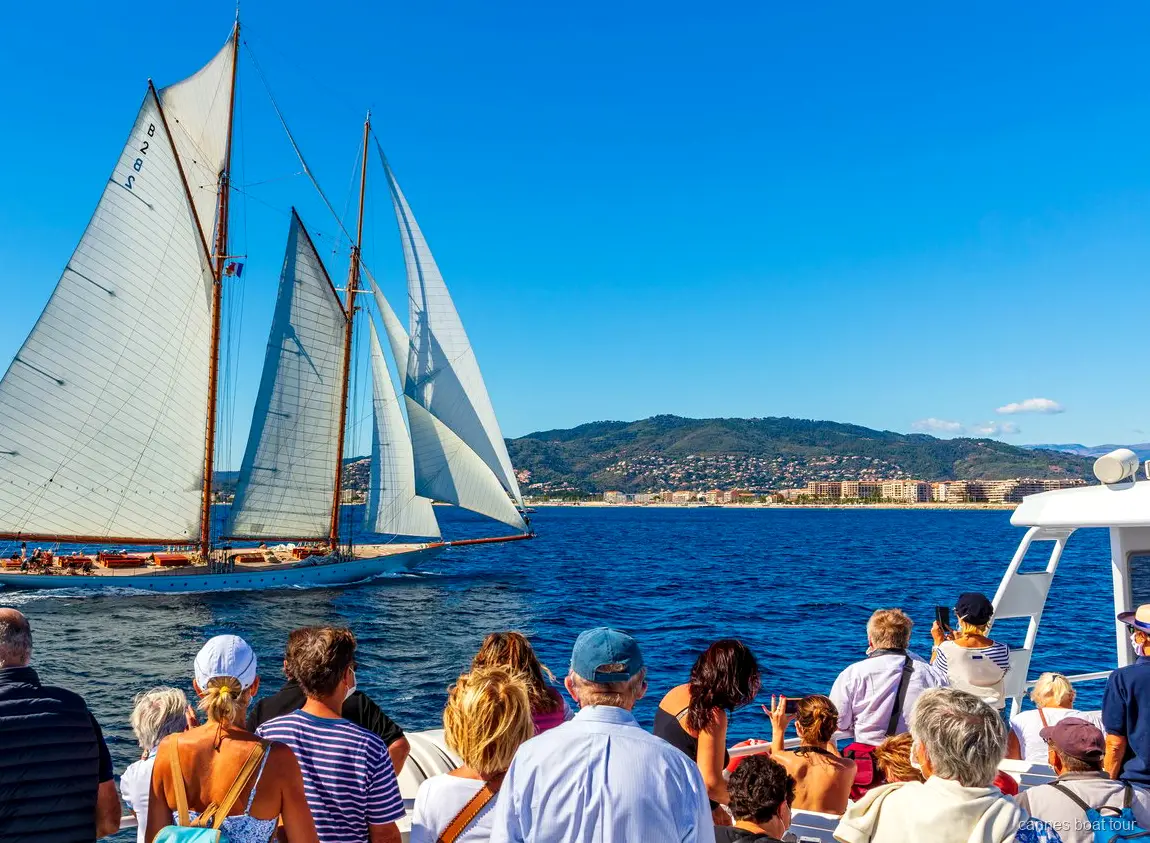 Catamaran following the Cannes Royal Regatta race fleet